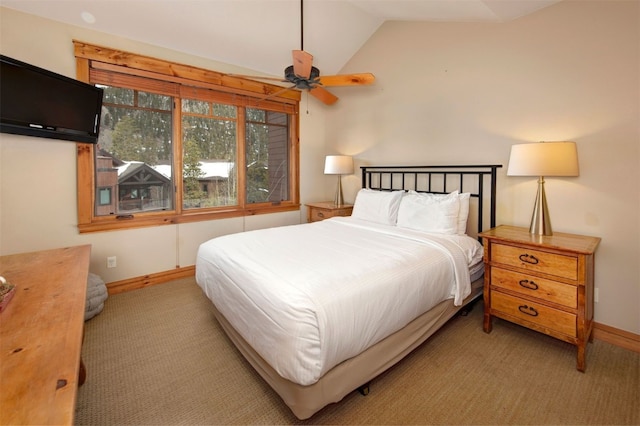 bedroom with lofted ceiling, baseboards, and light colored carpet