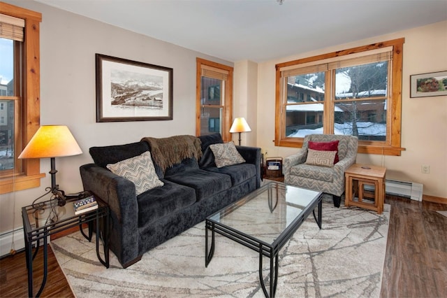 living room featuring a baseboard radiator and hardwood / wood-style floors