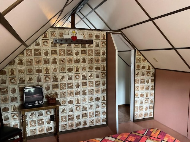 bonus room featuring vaulted ceiling