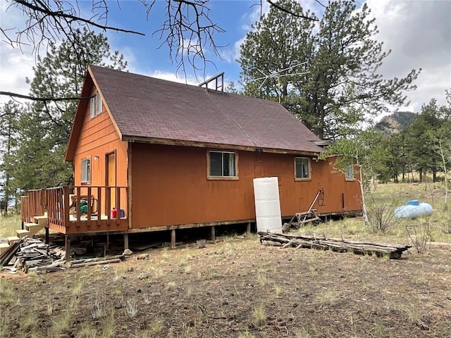 view of side of property featuring a deck