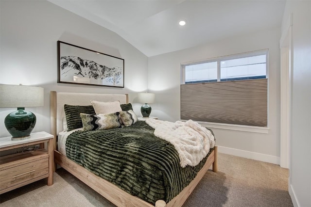 bedroom with light carpet and lofted ceiling