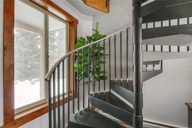 stairs with a baseboard heating unit