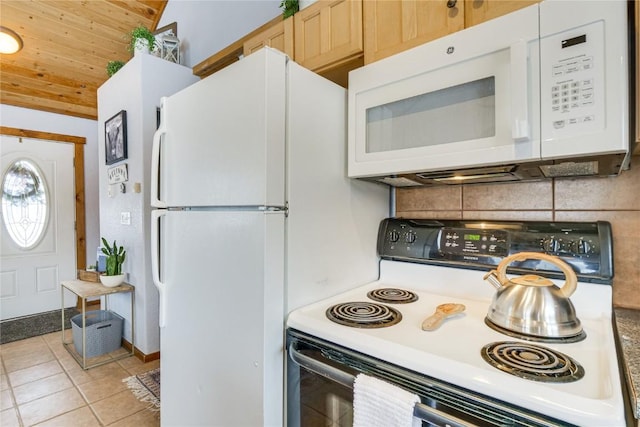 kitchen with light tile patterned floors, backsplash, white appliances, and light countertops