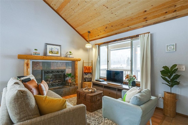 living area featuring wood finished floors, baseboards, high vaulted ceiling, a tiled fireplace, and wooden ceiling