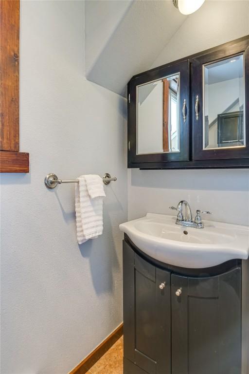 bathroom featuring vanity and baseboards