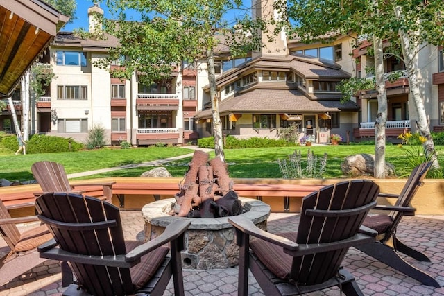 view of patio with a fire pit