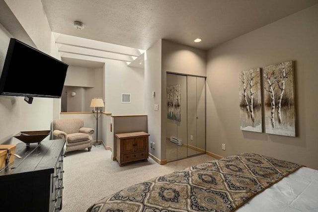 carpeted bedroom with a closet