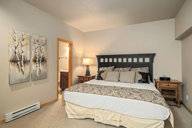 bedroom featuring ensuite bath, carpet, and a baseboard heating unit