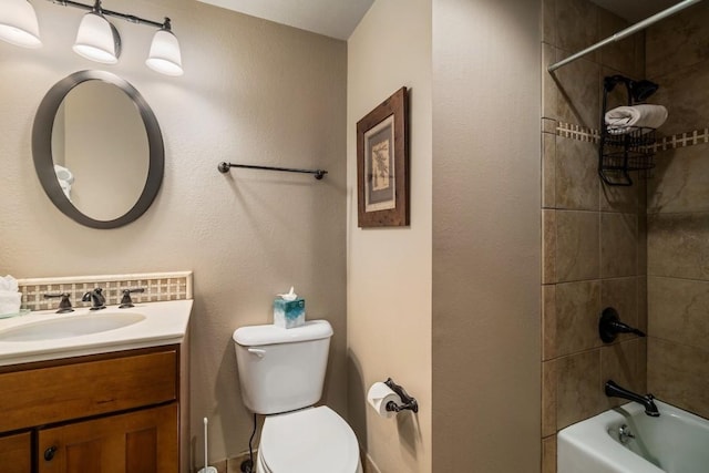 full bathroom with toilet, vanity, backsplash, and tiled shower / bath combo