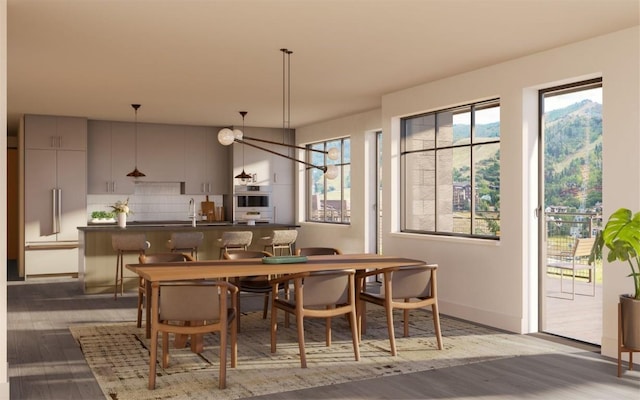 dining space with dark wood-type flooring