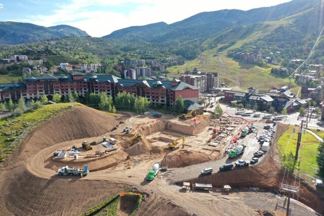 birds eye view of property with a mountain view