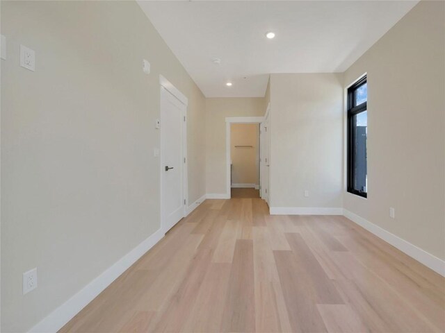 unfurnished room with light hardwood / wood-style flooring