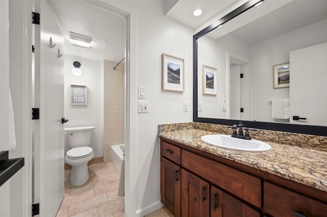 full bathroom with bathtub / shower combination, vanity, toilet, and baseboards