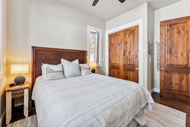 bedroom featuring a closet, ceiling fan, baseboards, and wood finished floors