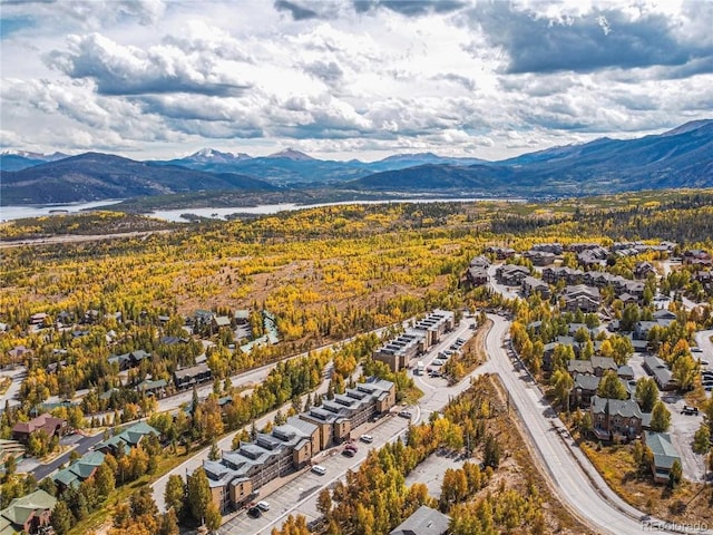 bird's eye view with a water and mountain view