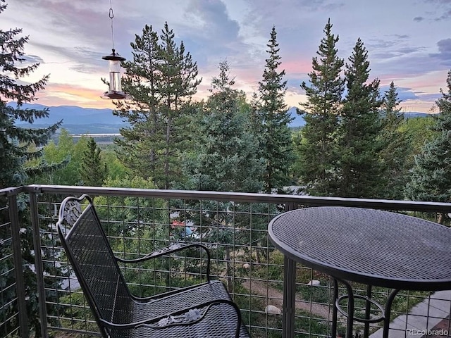 balcony at dusk with a mountain view