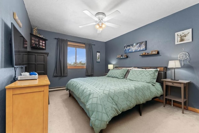 carpeted bedroom featuring ceiling fan and a baseboard radiator