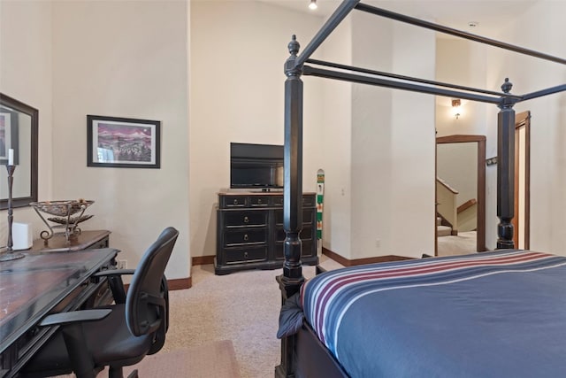 bedroom featuring carpet flooring and baseboards