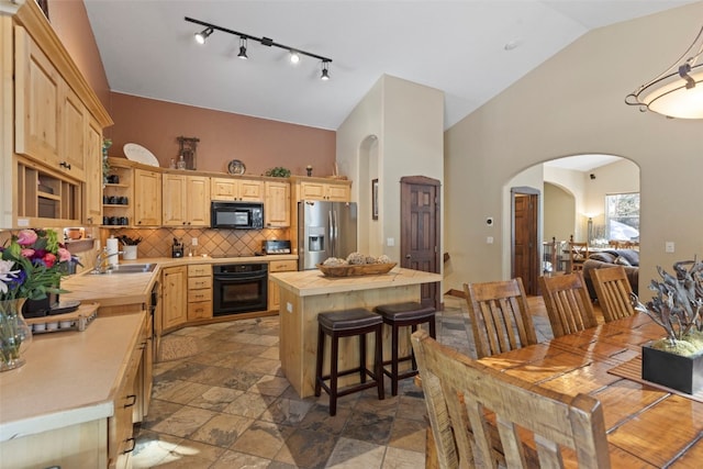 kitchen featuring black appliances, light brown cabinets, and open shelves