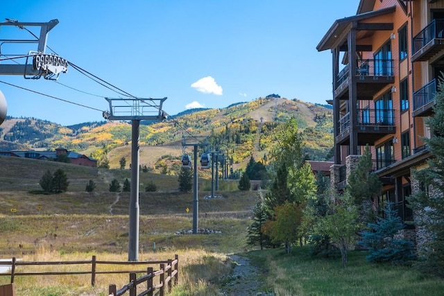 view of yard with a mountain view and a rural view