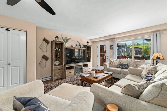 living room with french doors, hardwood / wood-style flooring, a baseboard radiator, and ceiling fan