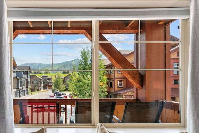 doorway to outside with a mountain view and a wealth of natural light