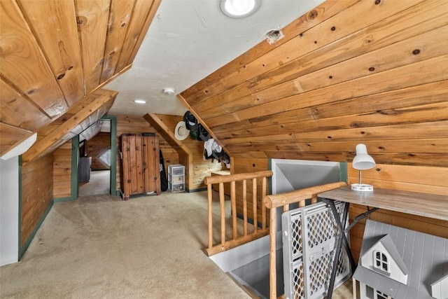 additional living space with lofted ceiling, wood walls, carpet, and wooden ceiling