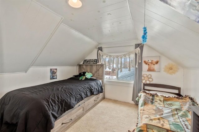 bedroom featuring lofted ceiling and carpet floors