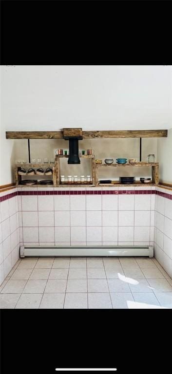 bathroom featuring tile patterned flooring and baseboard heating