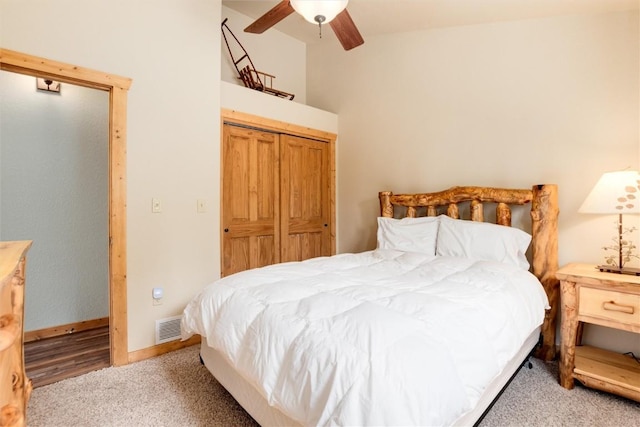 carpeted bedroom with a closet and ceiling fan