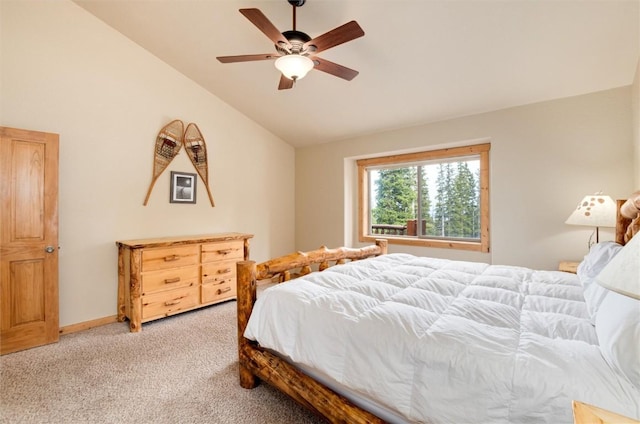 carpeted bedroom featuring ceiling fan and vaulted ceiling