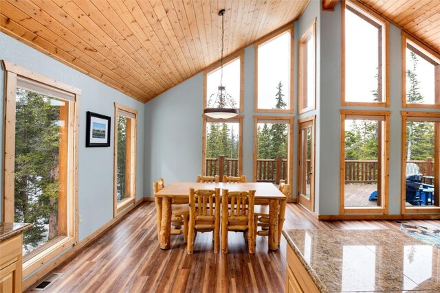 sunroom with vaulted ceiling and wooden ceiling