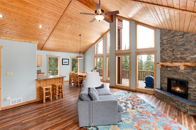 living room featuring wood-type flooring, high vaulted ceiling, and wooden ceiling