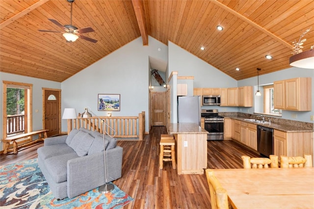 kitchen with stainless steel appliances, sink, pendant lighting, light brown cabinets, and dark hardwood / wood-style floors