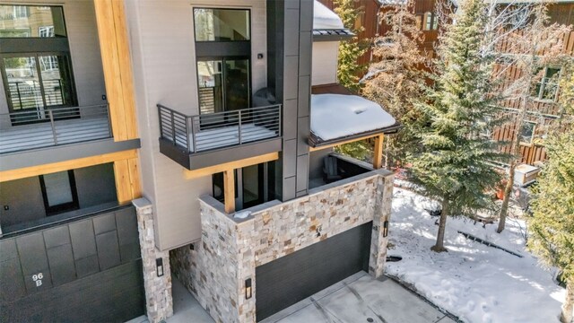 exterior space featuring stone siding