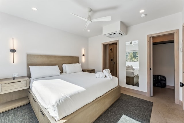 bedroom featuring a ceiling fan, a wall unit AC, and recessed lighting