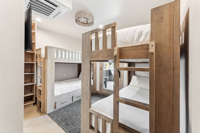 bedroom with visible vents and carpet floors