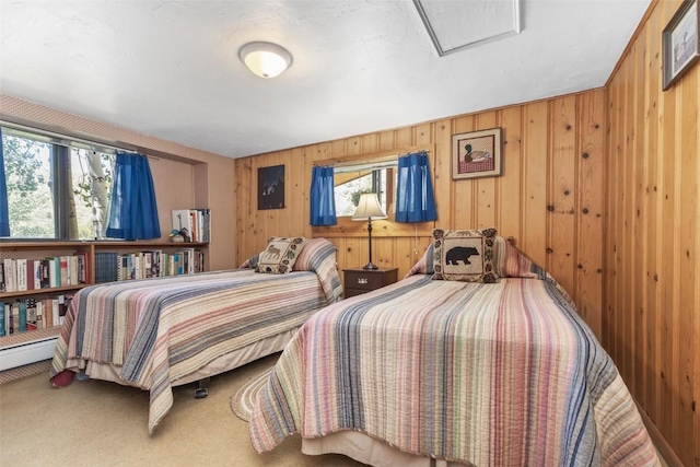 bedroom with carpet flooring and wooden walls