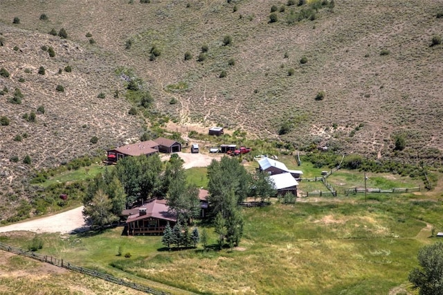 birds eye view of property with a rural view