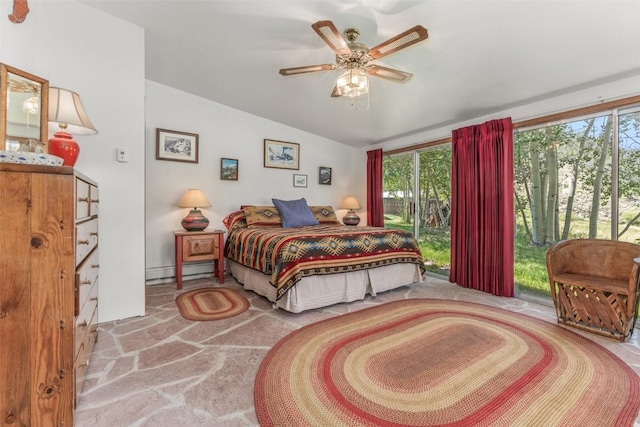 bedroom with vaulted ceiling, ceiling fan, and a baseboard heating unit