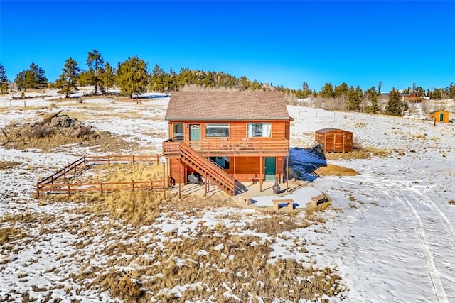 view of snow covered house