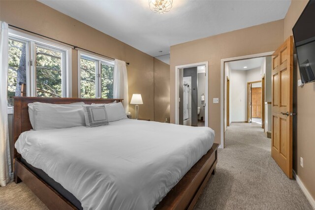 bedroom featuring light colored carpet