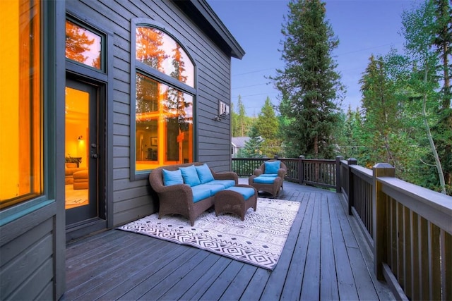 wooden terrace with outdoor lounge area