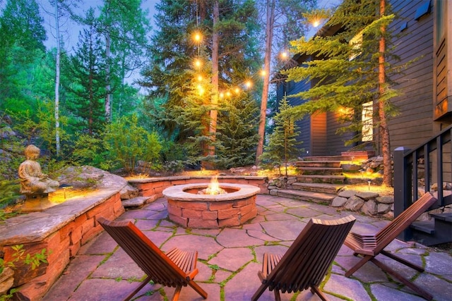 view of patio / terrace featuring a fire pit