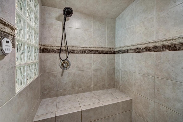 bathroom with tiled shower