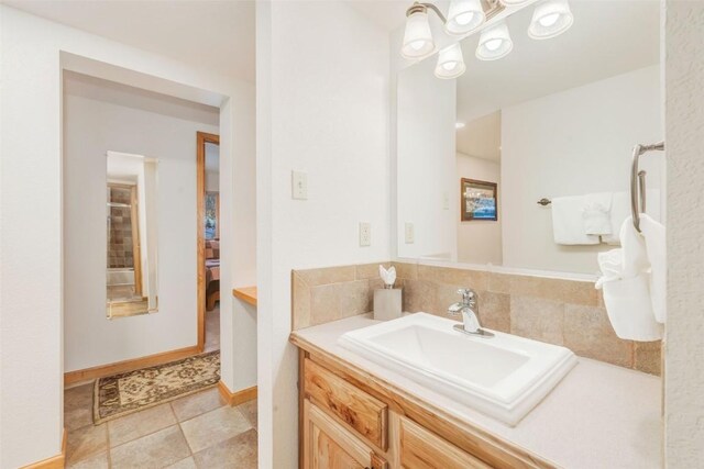 bathroom with tile patterned flooring and vanity