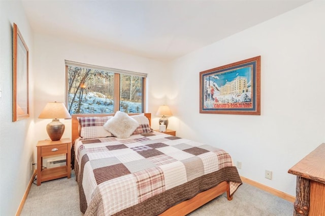 bedroom with light colored carpet