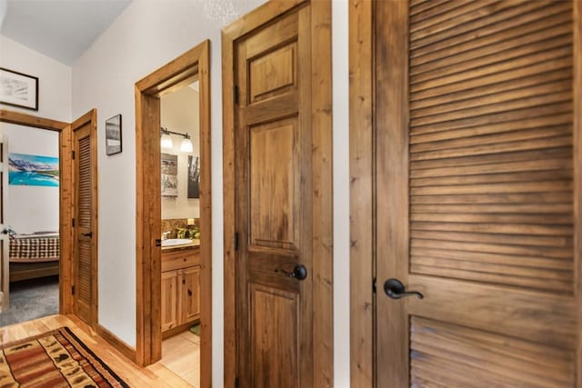 hallway featuring a sink