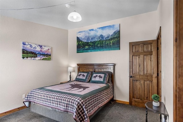 carpeted bedroom featuring baseboards