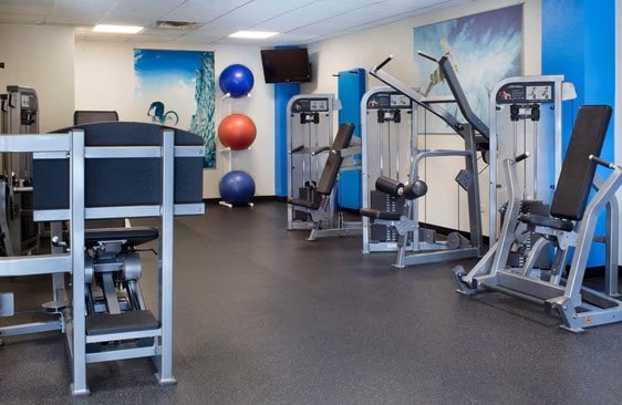 exercise room with a drop ceiling